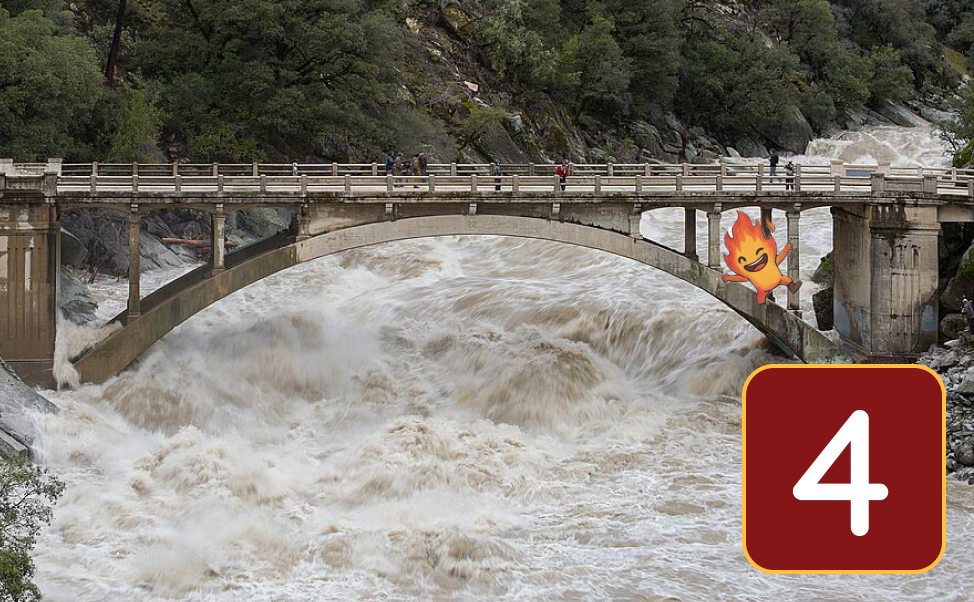 Raging water running under an arched bridge with people looking on, and a fire sprite cheering!
